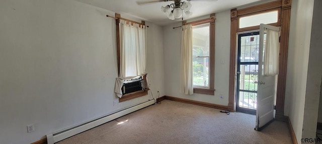 unfurnished living room with light carpet, a baseboard radiator, and ceiling fan