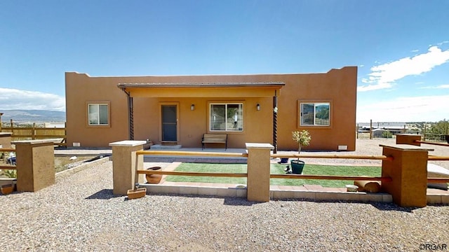 back of property featuring a mountain view