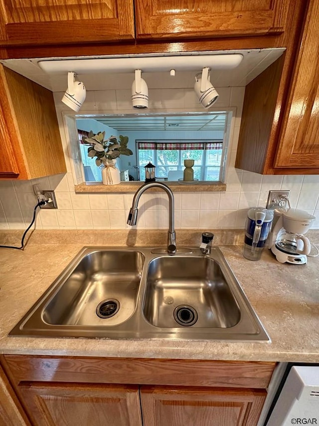 kitchen featuring sink and backsplash