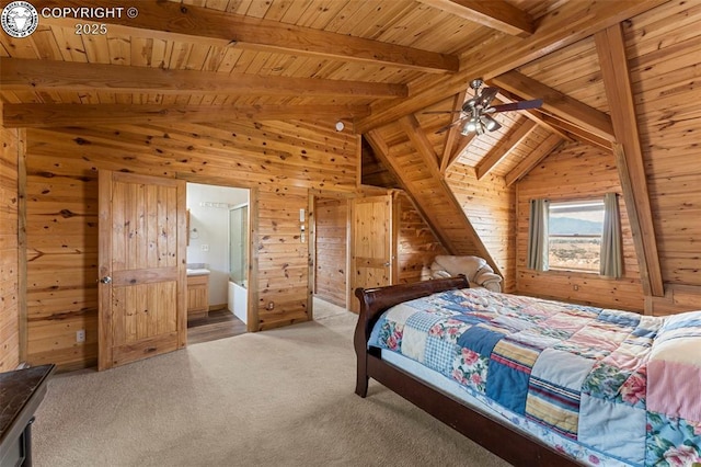 bedroom with ensuite bathroom, wooden walls, vaulted ceiling with beams, light colored carpet, and wooden ceiling