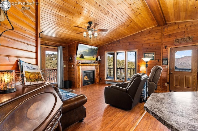 living room with wood ceiling, vaulted ceiling with beams, hardwood / wood-style flooring, and wooden walls