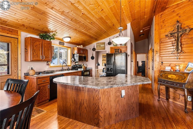 kitchen featuring sink, wood-type flooring, decorative light fixtures, wooden ceiling, and black appliances