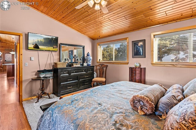 bedroom featuring wood-type flooring, lofted ceiling, wooden ceiling, and ceiling fan