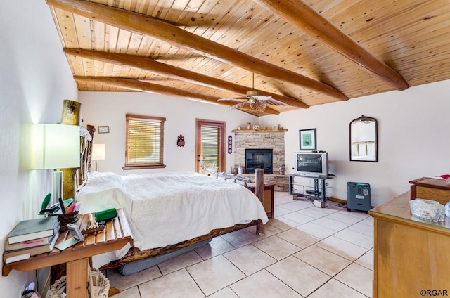 bedroom featuring a fireplace, light tile patterned floors, ceiling fan, wooden ceiling, and beam ceiling