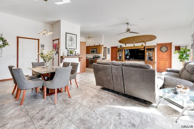 dining area with ceiling fan with notable chandelier