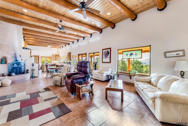 living room featuring ceiling fan, wooden ceiling, and beam ceiling