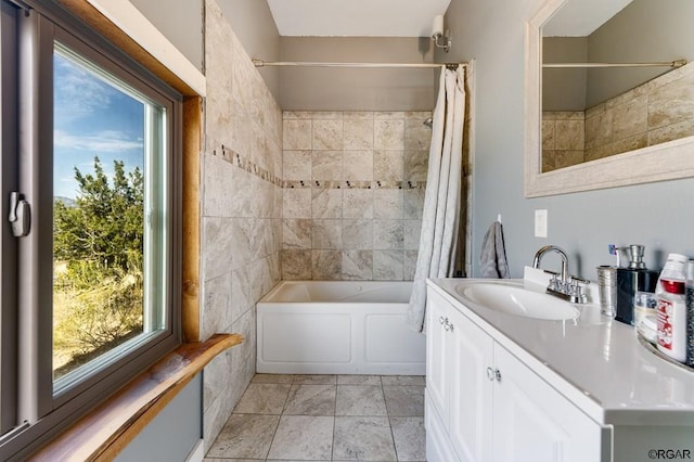 bathroom featuring vanity, plenty of natural light, and shower / bath combo with shower curtain