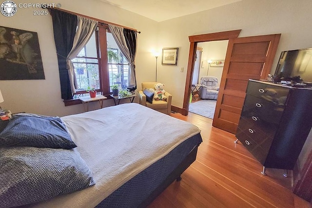 bedroom featuring hardwood / wood-style floors