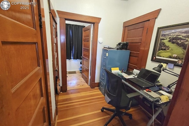 office space with hardwood / wood-style floors