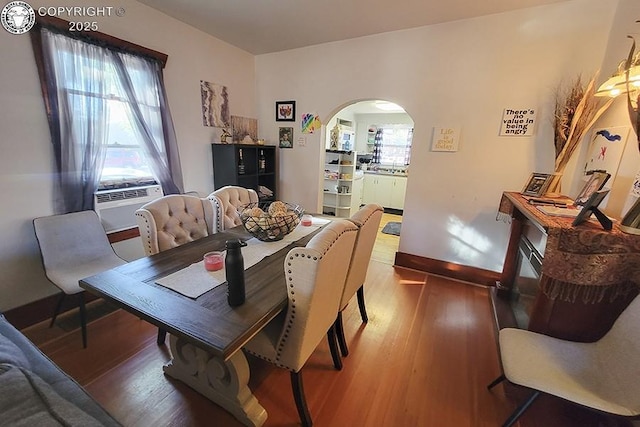 dining room featuring cooling unit and wood-type flooring