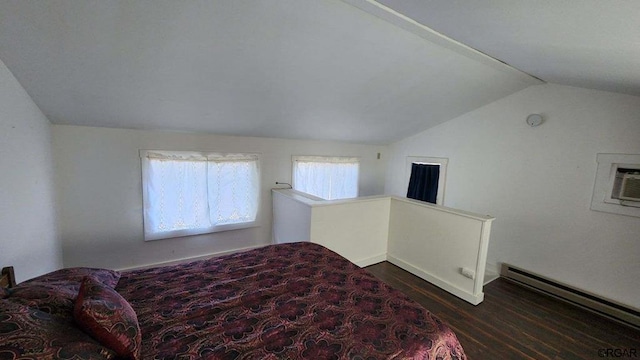 bedroom with dark wood-type flooring, vaulted ceiling, and a baseboard radiator