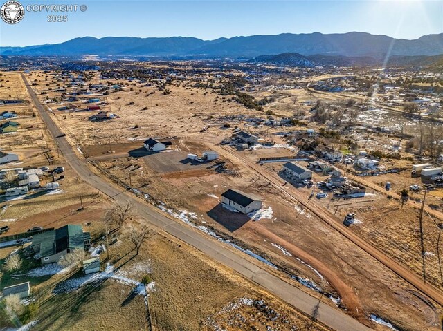 drone / aerial view featuring a mountain view