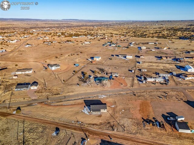 birds eye view of property featuring a rural view