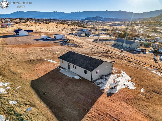 drone / aerial view featuring a mountain view