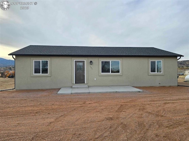 back of property featuring a patio