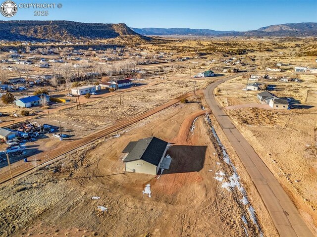 drone / aerial view featuring a mountain view