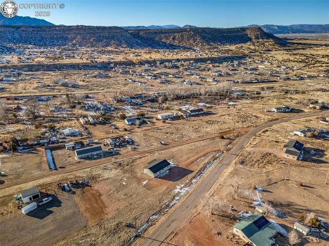 drone / aerial view featuring a mountain view