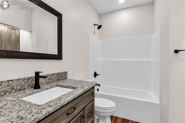 full bathroom with vanity, toilet, and shower / tub combination