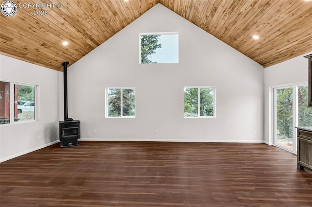 unfurnished living room with wooden ceiling, high vaulted ceiling, dark wood-style flooring, and a wood stove