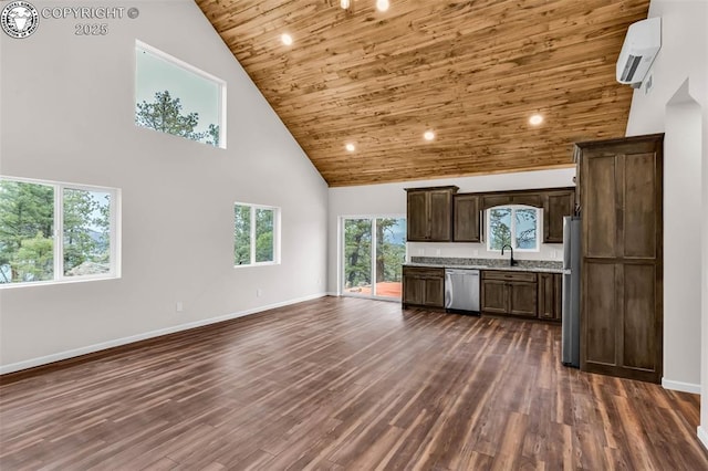 kitchen featuring a wall unit AC, appliances with stainless steel finishes, wooden ceiling, high vaulted ceiling, and a sink