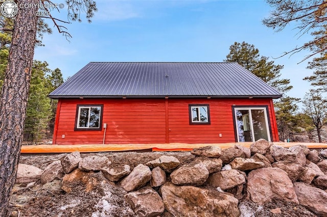 view of property exterior featuring metal roof