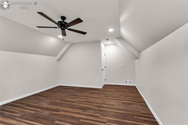 bonus room with dark wood finished floors, visible vents, baseboards, and a ceiling fan