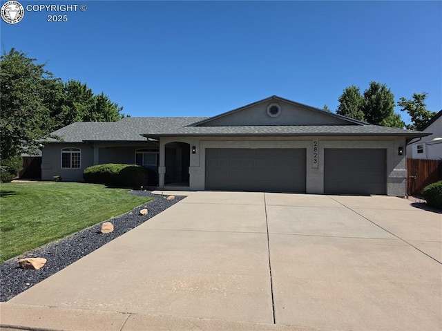 2823 River Run Ct, Canon City, CO 81212 - ranch-style house featuring a garage, driveway, a front yard, stucco siding, and a shingled roof