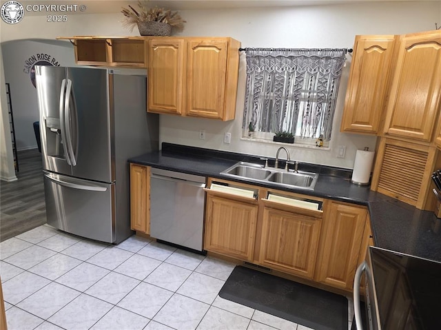 2823 River Run Ct, Canon City, CO 81212 - kitchen featuring appliances with stainless steel finishes, light tile patterned floors, and dark countertops