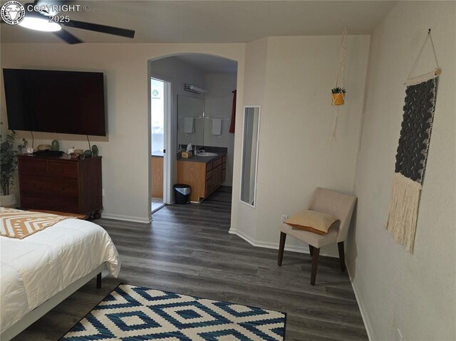 2823 River Run Ct, Canon City, CO 81212 - bedroom with arched walkways, dark wood finished floors, and ensuite bath