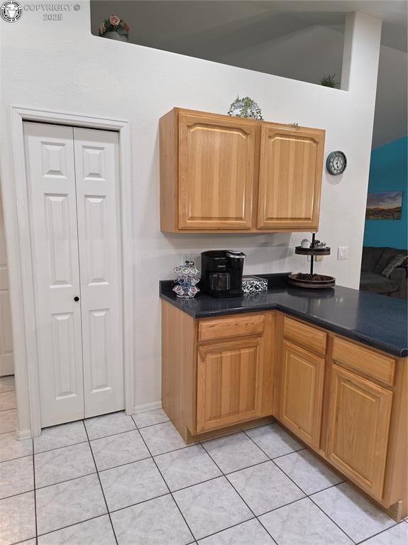 2823 River Run Ct, Canon City, CO 81212 - kitchen with dark countertops and light tile patterned flooring