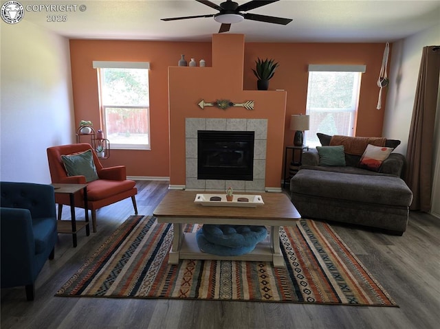 2823 River Run Ct, Canon City, CO 81212 - living room featuring wood finished floors, healthy amount of natural light, ceiling fan, and a tiled fireplace