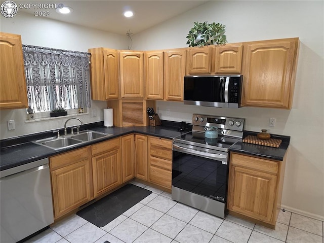 2823 River Run Ct, Canon City, CO 81212 - kitchen with appliances with stainless steel finishes, dark countertops, light tile patterned floors, and recessed lighting