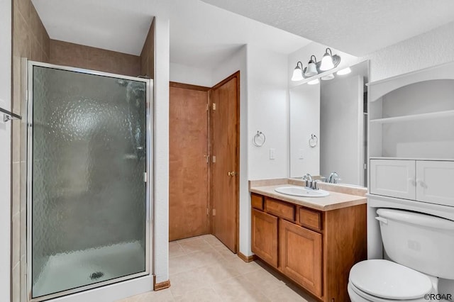 bathroom with walk in shower, tile patterned floors, toilet, and vanity