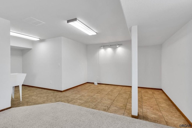 basement with tile patterned floors