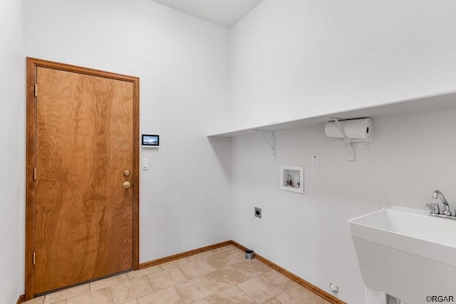 laundry area featuring hookup for an electric dryer, sink, and washer hookup