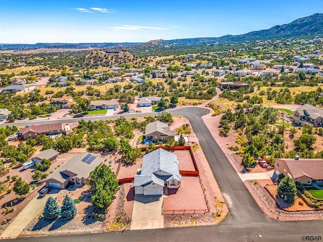 birds eye view of property with a mountain view