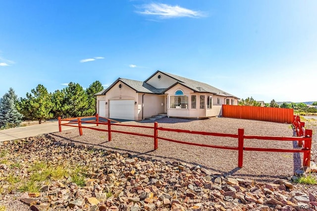 ranch-style house featuring a garage