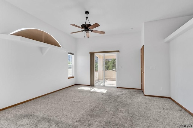 empty room featuring ceiling fan and carpet flooring