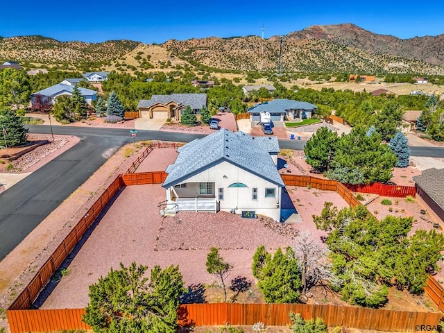 birds eye view of property with a mountain view