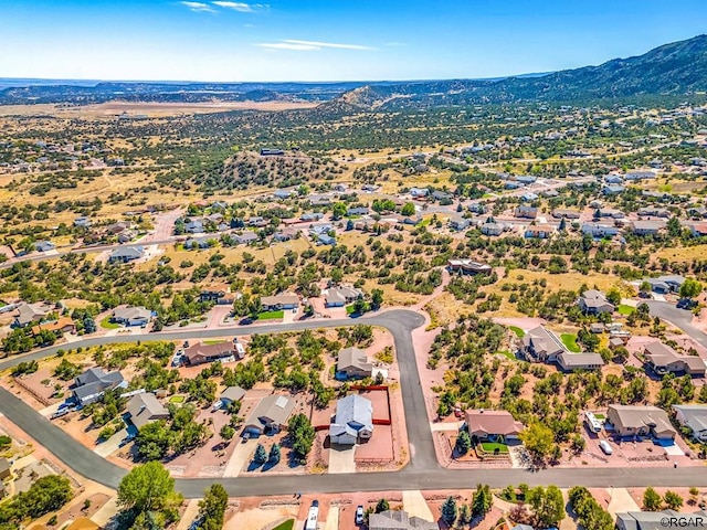 birds eye view of property featuring a mountain view