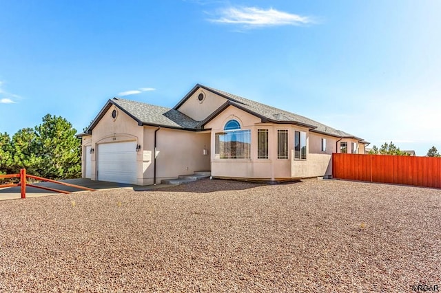 ranch-style home featuring a garage