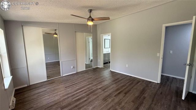 1157 County Road 119, Florence, CO 81226 - unfurnished bedroom featuring dark wood-style flooring, a closet, a textured ceiling, ensuite bathroom, and baseboards