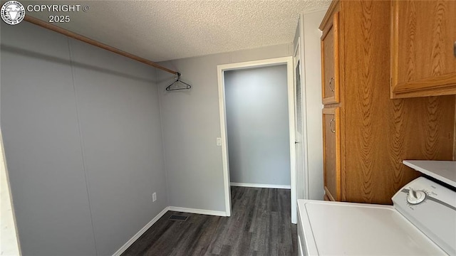 1157 County Road 119, Florence, CO 81226 - laundry room featuring washer / clothes dryer, dark wood-type flooring, a textured ceiling, and baseboards
