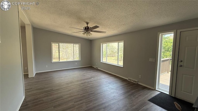 1157 County Road 119, Florence, CO 81226 - foyer with a textured ceiling, plenty of natural light, ceiling fan, dark wood finished floors, and baseboards
