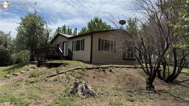 1157 County Road 119, Florence, CO 81226 - view of side of property with a deck