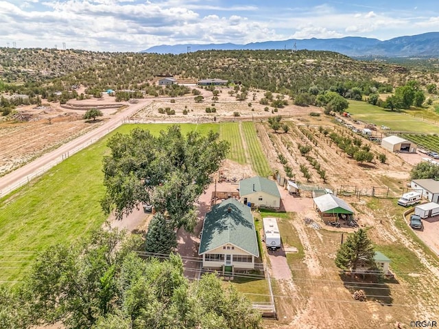 drone / aerial view featuring a rural view and a mountain view