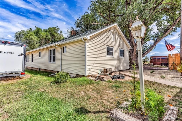 view of property exterior featuring a yard