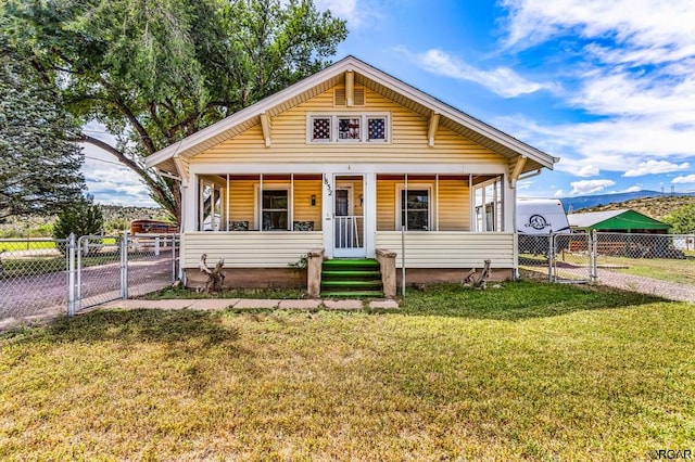 bungalow-style home featuring a front yard