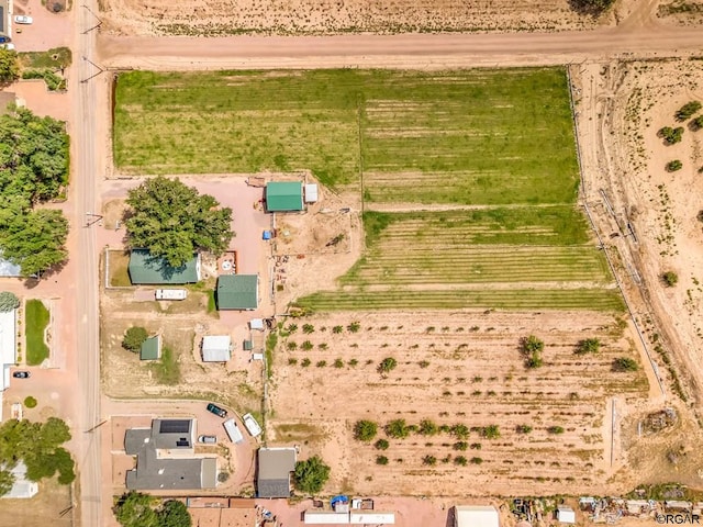 birds eye view of property with a rural view