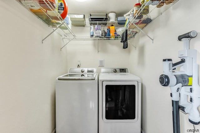 washroom featuring independent washer and dryer